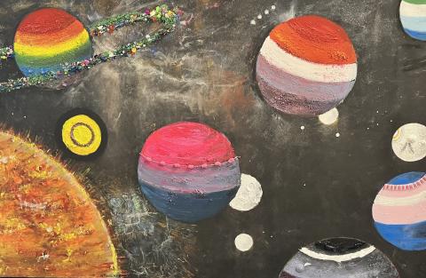 We received a SD 62 grant to create an inclusive, 2SLGBTQIA+ mural depicting the various SOGI Flags as planets.